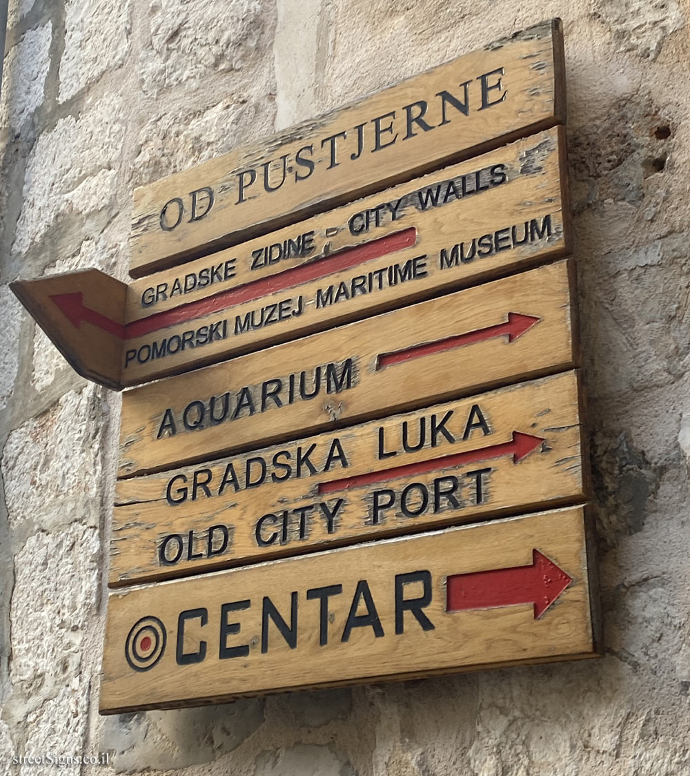 Dubrovnik - A directional sign pointing to sites in the city from Pustijerne Street