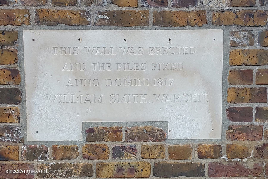 London - Greenwich - Signs on a wall on the bank of the Thames indicating the tide levels - 18 Highbridge Wharf, London SE10 9PS, UK