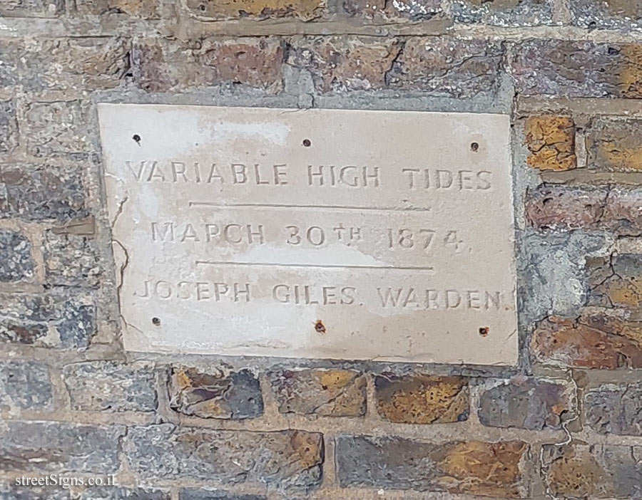 London - Greenwich - Signs on a wall on the bank of the Thames indicating the tide levels - 18 Highbridge Wharf, London SE10 9PS, UK