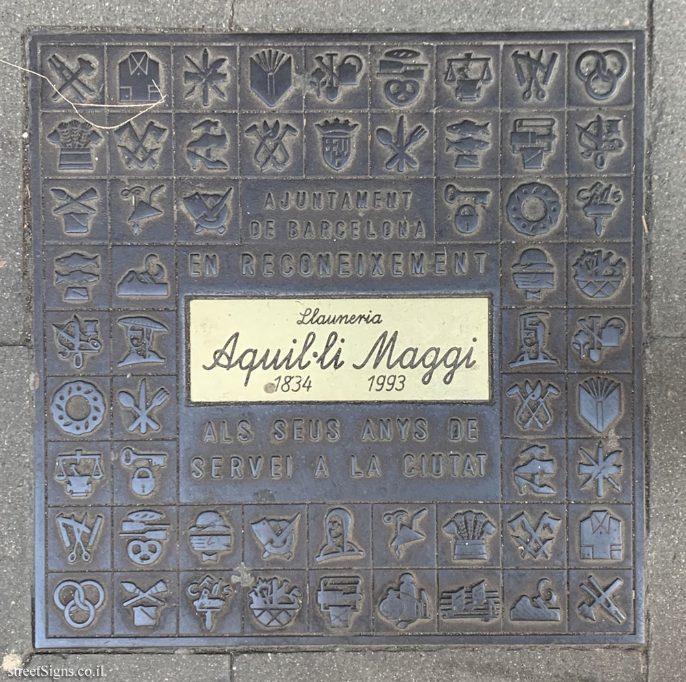 Barcelona - A plaque honoring the Handicraft Art Shop Aquil·lí Maggi