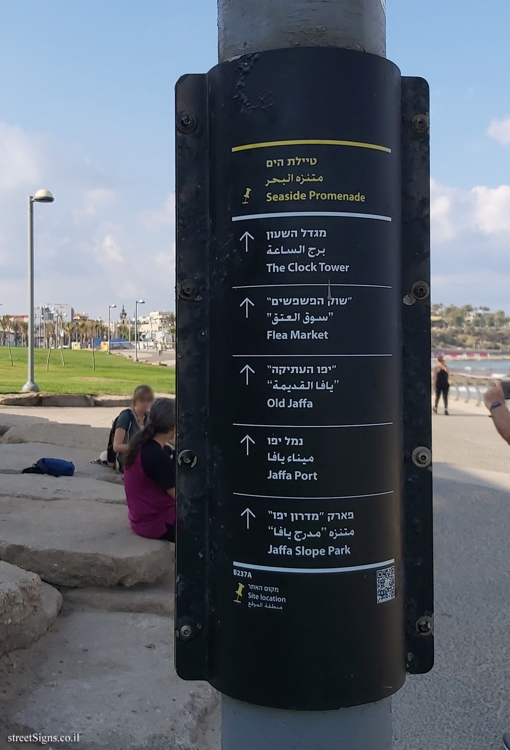 Tel Aviv - A Direction sign in the shape of a roll